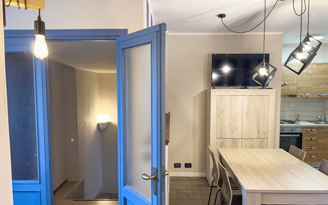 Apartment Tre - Diano Marina: Furniture, Building, Table, Wood, Interior Design, Floor, Flooring, Door, Wall, Real Estate