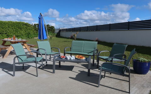 Les Agapanthes: Cloud, Sky, Furniture, Chair, Shade, Plant, Outdoor Furniture, Grass, Urban Design, Leisure