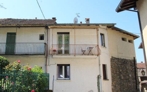 Borghetto: Sky, Building, Property, Window, Plant, Flower, Blue, House, Architecture, Vehicle