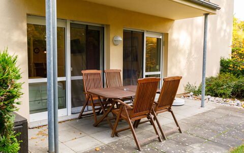 Koserow 211: Plant, Building, Property, Furniture, Chair, Table, Shade, Window, Wood, Interior Design