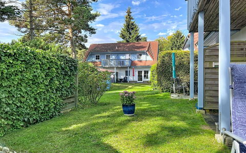 Zinnowitz 111: Blue, House, Shrub, Residential Area, Home, Roof, Cottage, Garden, Lawn, Groundcover