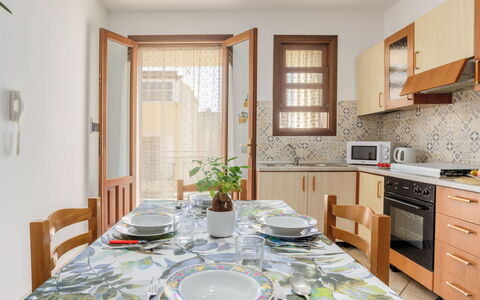 Giardini Gaia: Property, Cabinetry, Furniture, Table, Plant, Building, Countertop, Interior Design, Wood, Lighting