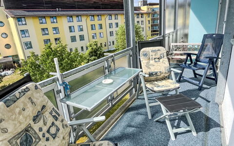 Karsten: Building, Property, Window, Table, Sky, Urban Design, Outdoor Furniture, Couch, Chair, Cloud
