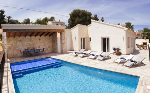 Casa Baruffa: Flower, Plant, Furniture, Property, Window, Building, Green, Chair, Table, Sky