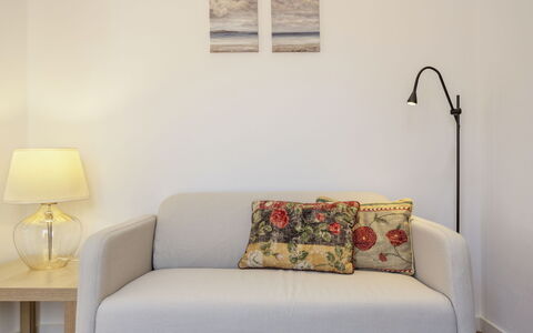 Dona Meia Praia: Furniture, Plant, Couch, Rectangle, Building, Wood, Interior Design, Yellow, Floor, Wall