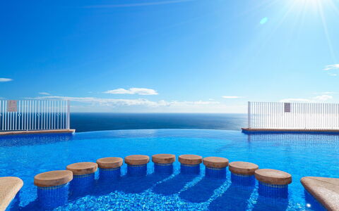 Las Brisas: Water, Table, Sky, Cloud, Furniture, Plant, Property, Chair, Azure, Outdoor Table