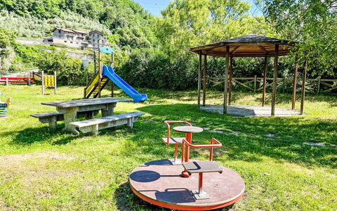 Leonardo: Public Space, Outdoor Play Equipment, Park, Garden, Shade, Lawn, Landscaping, Yard, Playground, Outdoor Furniture
