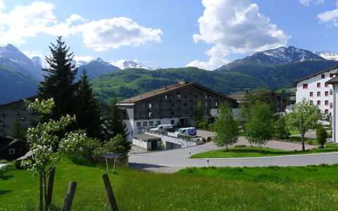 Disentis 105: Cloud, Sky, Plant, Mountain, Building, Property, Green, Natural Environment, Natural Landscape, Tree