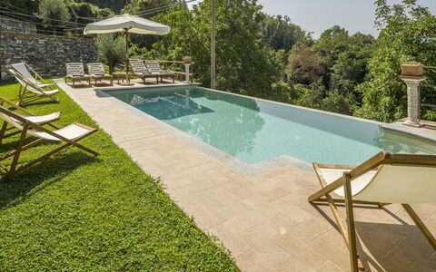 Casa Aurora - Recco, Liguria: Water, Property, Plant, Swimming Pool, Tree, Outdoor Furniture, Shade, Sky, Grass, Building