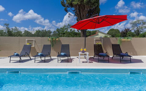 Noce: Water, Sky, Cloud, Furniture, Property, Swimming Pool, Umbrella, Building, Azure, Tree