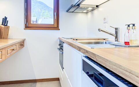 Champex 220: Kitchen, Countertop, Wood, Interior Design, Flooring, Kitchen Appliance, Major Appliance, Cabinetry, Plumbing Fixture, Kitchen Sink