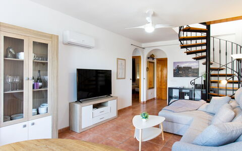 Velez: Couch, Furniture, Property, Picture Frame, Wood, Table, Interior Design, Living Room, Home Appliance, Floor