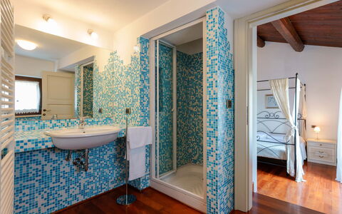 Villa Pagannoni: Mirror, Plumbing Fixture, Blue, Azure, Sink, Plant, Bathroom, Interior Design, Tap, Floor