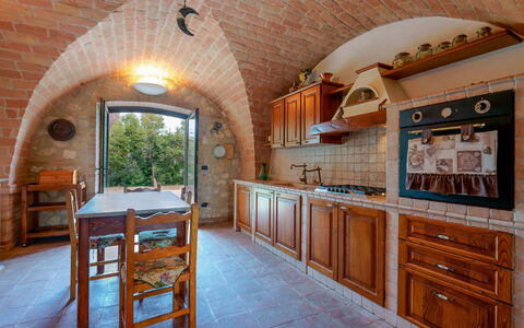 Villa Pagannoni: Furniture, Cabinetry, Table, Countertop, Wood, Chair, Interior Design, Kitchen, Floor, Wall