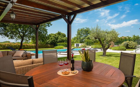 Villa Grando i: Sky, Plant, Furniture, Plant Community, Table, Natural Landscape, Chair, Land Lot, Outdoor Furniture, Tree