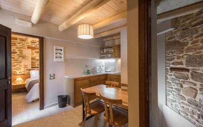Lameriana Superior Suite with Hot Tub 14.3: Furniture, Table, Building, Wood, Cabinetry, Interior Design, Kitchen, Flooring, Comfort, Floor