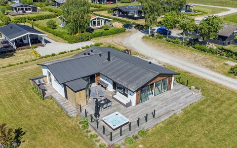 Niska - 200M from the Sea: Roof, Home, Door, Cottage, Shade, Siding, Yard, Estate, Backyard
