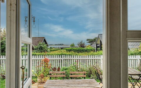 Ilkka - 220M from the Sea: Door, Flowerpot, Porch, Garden, Chair, Houseplant, Cottage, Eco Hotel, Balcony