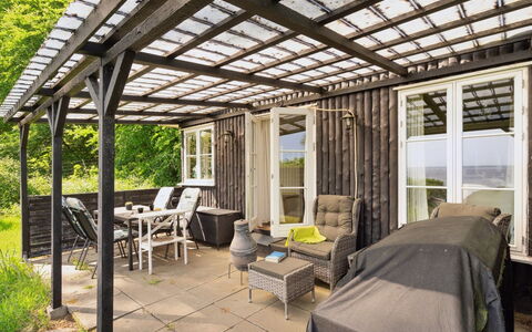 Ginne - 100M to the Fjord: Wood, Porch, Furniture, Outdoor Furniture, Door, Home, Outdoor Table, Deck, Chair, Shade