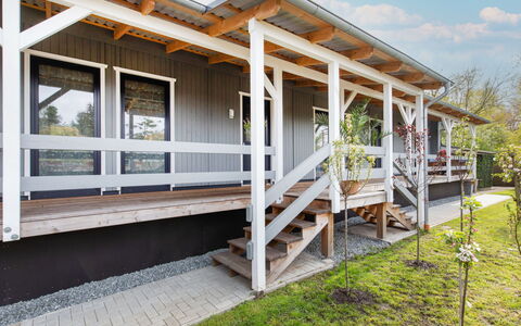 Wingst 100: Property, Plant, Cloud, Wood, Building, Shade, Land Lot, Sky, Cottage, Siding