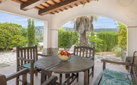 Can Maggi: Furniture, Table, Building, Chair, Tableware, Cloud, Sky, Tablecloth, Outdoor Furniture, Shade