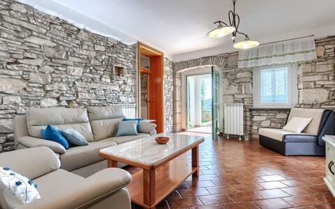 Villa Dina: Wall, Flooring, Interior Design, Furniture, Floor, Ceiling, Stone Wall, Living Room, Room, Couch