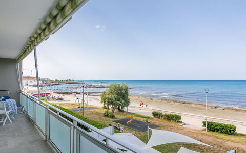 Massimo Beach House: Cloud, Sky, Plant, Arecales, Shade, Tree, Coastal And Oceanic Landforms, Leisure, Terrestrial Plant, Boat