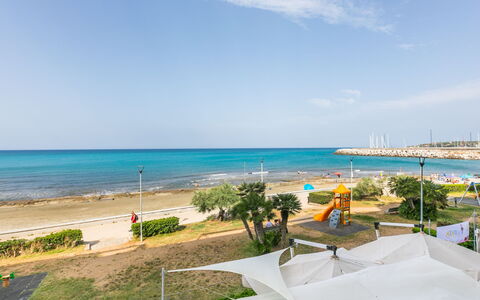 Massimo Beach House: Cloud, Sky, Plant, Arecales, Shade, Tree, Coastal And Oceanic Landforms, Leisure, Terrestrial Plant, Boat