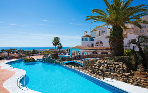Limoneros: Water, Plant, Sky, Property, Building, Blue, Azure, Swimming Pool, Seaside Resort, Tree