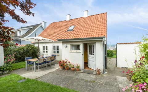 Merete - 50M from the Sea: Roof, House, Home, Cottage, Siding, Estate, Driveway, Garden Buildings, Yard, Shed