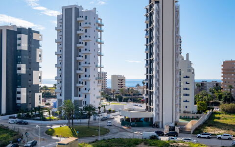 Sunrise Tower: Sky, Daytime, Building, Apartment, Urban Area, Neighbourhood, Condominium, Residential Area, Metropolitan Area