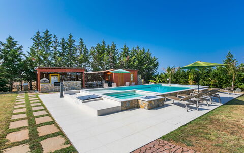 Villa della Duna: Sky, Plant, Tree, Shade, Swimming Pool, Outdoor Furniture, Urban Design, House, Landscape, Grass