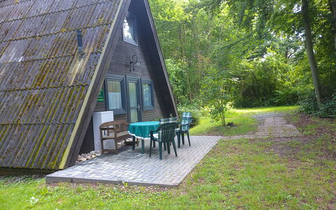 Marie: Plant, Tree, Shade, Table, Land Lot, Sky, Outdoor Furniture, Grass, Cottage, Natural Landscape