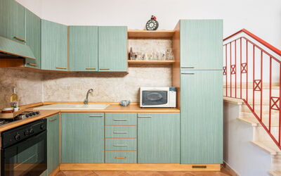Il Nido di Mennenne 683.1: Cabinetry, Countertop, Furniture, Building, Kitchen Stove, Kitchen, Wood, Interior Design, Flooring, Kitchen Appliance