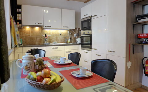 Tilia: Property, Cabinetry, Food, Countertop, Tableware, Table, Kitchen, Interior Design, Wood, Refrigerator