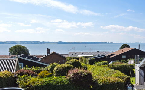Kerstin - 400M from the Sea: Roof, Home, Door, Cottage, Shade, Siding, Yard, Estate, Backyard