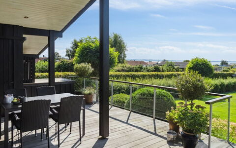 Kerstin - 400M from the Sea: Roof, Home, Door, Cottage, Shade, Siding, Yard, Estate, Backyard