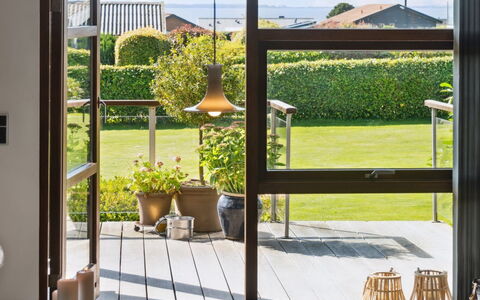 Kerstin - 400M from the Sea: Roof, Home, Door, Cottage, Shade, Siding, Yard, Estate, Backyard