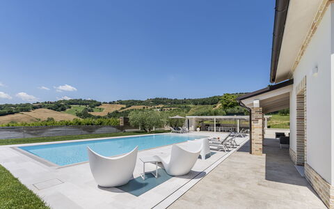 Villa Aso: Sky, Property, Building, Plant, Azure, Water, Chair, Outdoor Furniture, Swimming Pool, Interior Design