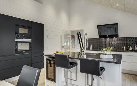 Jonne - 200M to the Fjord: Flooring, Interior Design, Wood, Ceiling, Floor, Furniture, Kitchen, Light Fixture, Countertop, Wood Flooring