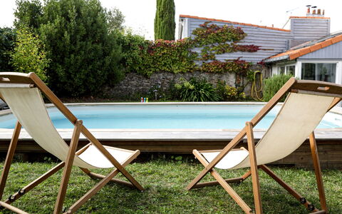 Le Bain du Papillon: Sky, Building, Property, Table, Furniture, Cloud, Mountain, Interior Design, Outdoor Furniture, Wood
