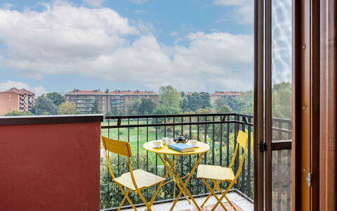 Ripamonti View Apartment: Furniture, Property, Sky, Building, Window, Table, Wood, Shade, Chair, Porch