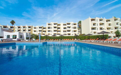 La Perle D'Albufeira: Water, Building, Property, Sky, Plant, Tree, Window, Leisure, Urban Design, Swimming Pool
