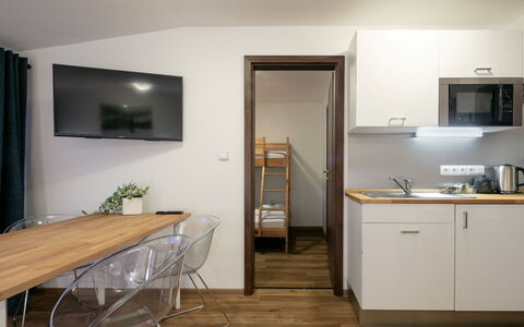 Janské Lázně 200: Furniture, Cabinetry, Building, Table, Wood, Countertop, Flooring, Floor, Wood Stain, Door