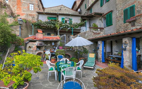 La Casa del Fale di Collodi: House, Shrub, Flowerpot, Garden, Courtyard, Yard, Houseplant, Hacienda, Landscaping, Balcony