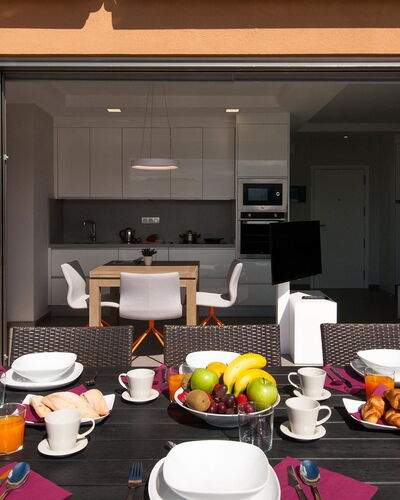 Nautilus: Tableware, Table, Property, Furniture, Dishware, Building, Plate, Chair, Orange, Interior Design
