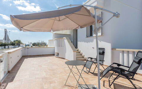 Marina di Pescoluse 651: Sky, Property, Building, Cloud, Shade, Outdoor Furniture, Wood, Interior Design, Real Estate, Chair