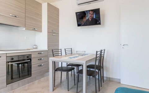 Marina di Pescoluse 651: Table, Furniture, Cabinetry, Chair, Building, Wood, Lighting, Interior Design, Kitchen & Dining Room Table, Countertop