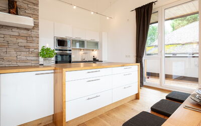 Christine Penthouse 500.2: Cabinetry, Furniture, Countertop, Building, Wood, Drawer, Interior Design, Flooring, Kitchen
