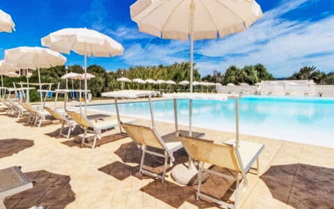 Happy Island: Sky, Property, Umbrella, Cloud, Shade, Outdoor Furniture, Water, Sunlounger, Leisure